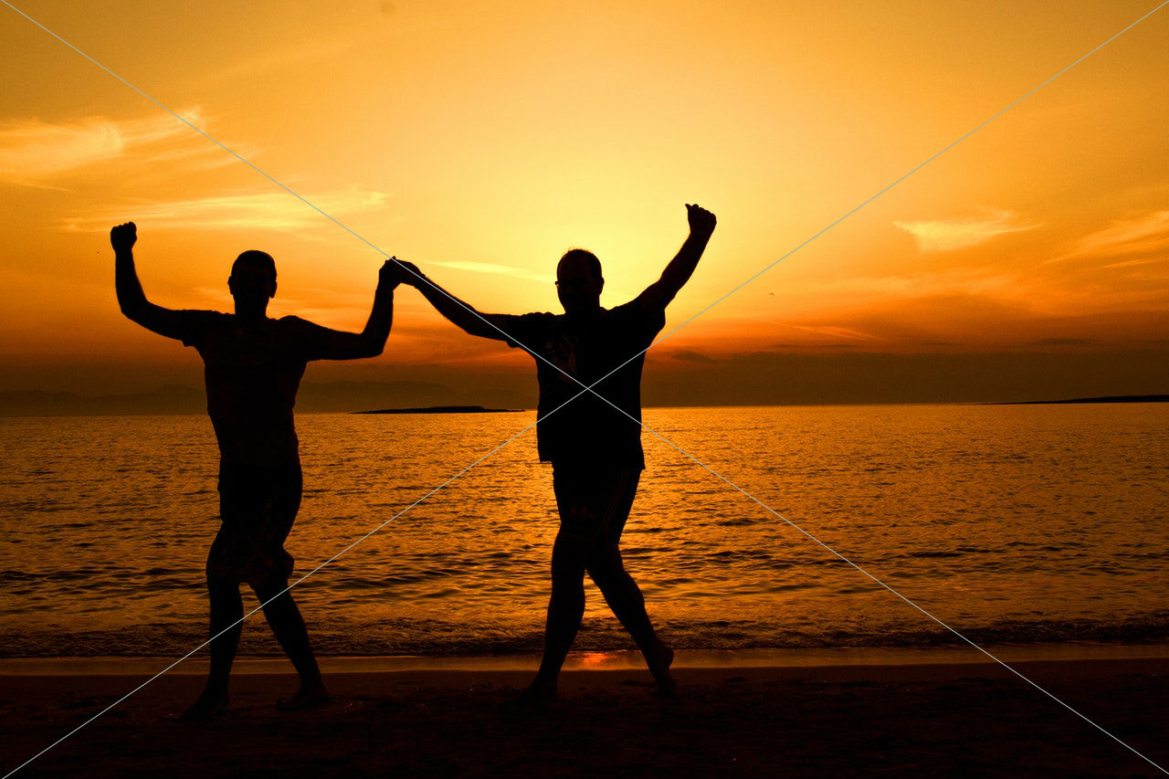 backlit beach couple
